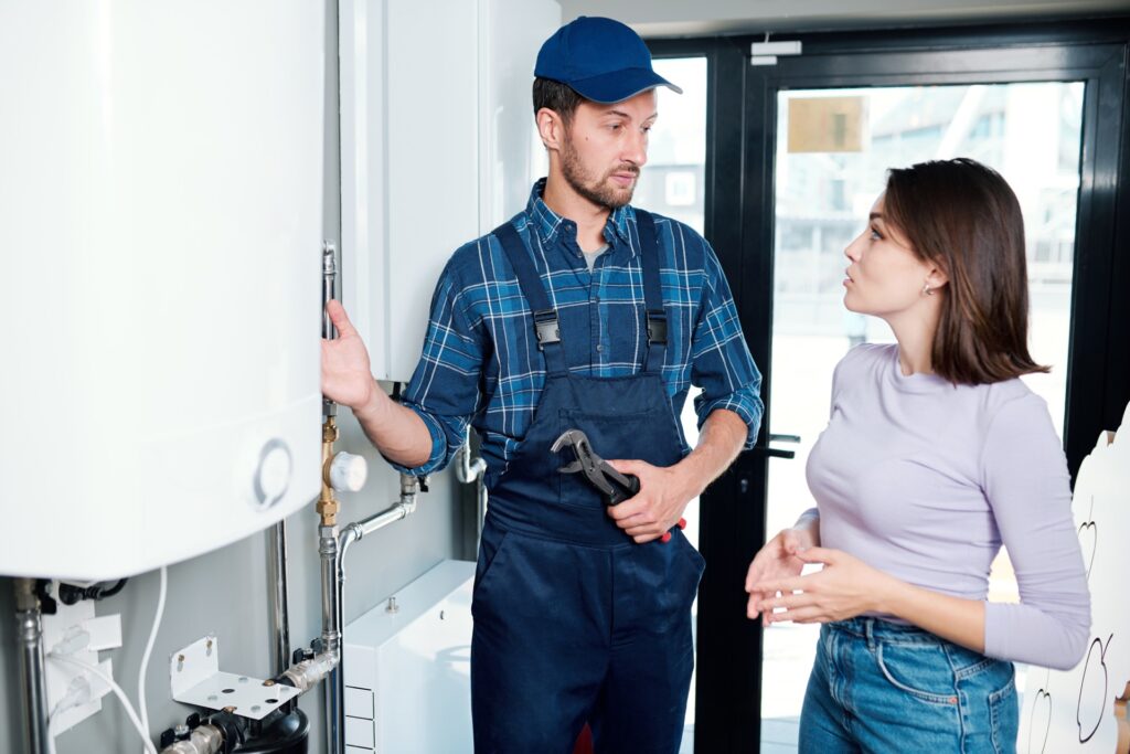 Plumber explaining repairs to customer